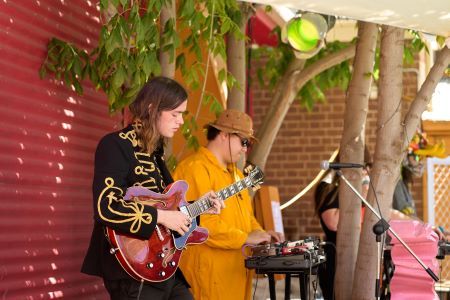 Two musicians playing outdoors