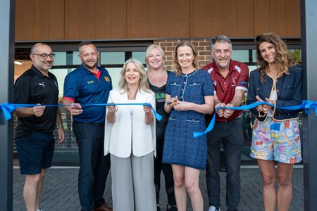 People cutting ceremonial ribbon