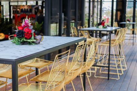 Bar seats outside of a cafe